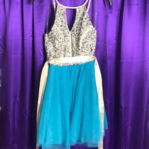 Above knee length blue dress. Jeweled top.
